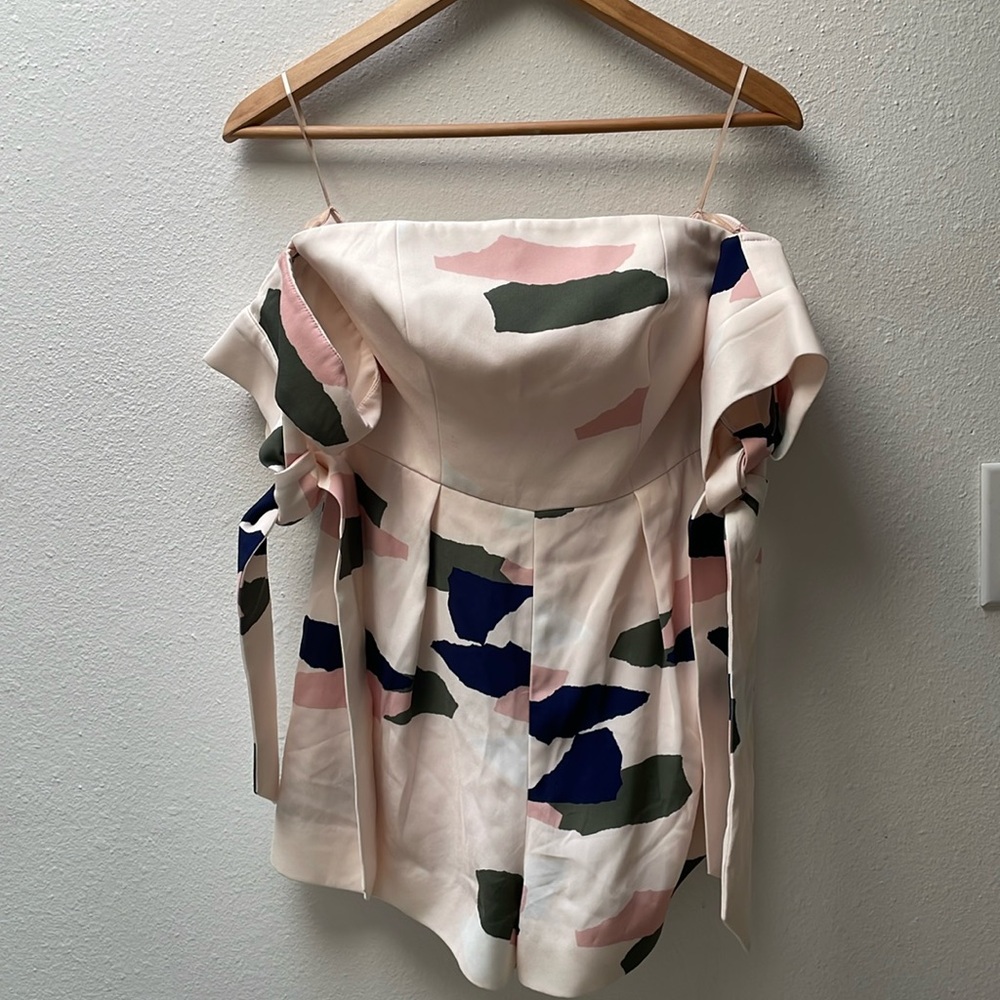 c/meo jumpsuit with off shoulder sleeves and shorts. So cute and flirty!